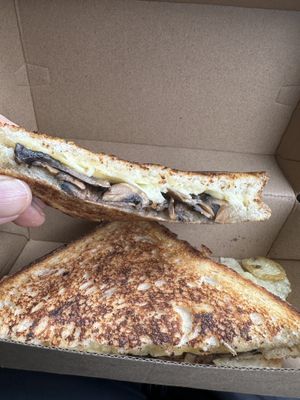 Mushroom toastie  at Jumi's Cafe in South Yarra