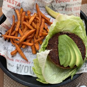 Impossible burger on lettuce wrap with sweet potato fries at WTF Burger Bar in Cabo San Lucas