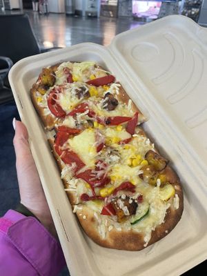 Vegan flatbread $15. I didn’t see another vegan option, but this was good. If I had to guess, they use Daiya. Very filling.   at MIA - Estefan Kitchen - N Terminal in Miami