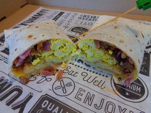 St. Patrick's Day Special Corn'd beef hash burrito. Sautéed Corn'd beef and onions, hash brown patty, tofu eggs, melted provolone. Vegan. at Birch Cafe in Highland Heights