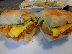 Sandwich Special Havana Cuban. Cuban bread topped with house made seitan ham, vegan cheese, pickles, mustard, and hearts of palm pulled pork. Includes a side of kettle chips.  at Birch Cafe in Highland Heights