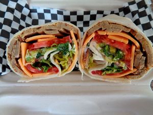 Stone Ground Mustard Turk'y Wrap. Seitan turk'y, stone ground mustard, cheddar, lettuce, tomato. Vegan. at Birch Cafe in Highland Heights