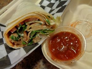 Mexicali Wrap. Chick'n tenders tossed in salsa, lettuce, tomato, vegan ranch, and cheddar cheese wrapped in a tortilla. Served with salsa on the side.  at Birch Cafe in Highland Heights