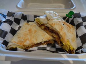 Corn’d beef hash breakfast crunchwrap special. Sautéed Corn'd beef and onions, a hash brown patty, tofu eggs, and melted provolone. Add a side of thousand island for a small upcharge. Vegan. at Birch Cafe in Highland Heights