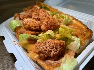 Po' Boi: Vegan Breaded Shrimp, Lettuce, Tomatoes w/ Housemade Cajun Sauce on a Crusty Baguette at Loving Hut in Redlands