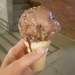 Chocolate Rain (V, DF, GF) - dark chocolate coconut ice cream w/ brownies, chocolate swirl, & chocolate chips at (402) Creamery in Lincoln