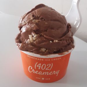 Twix-or-Treat (V, DF, GF) - chocolate coconut ice cream w/ shortbread cookies & a coconut caramel swirl at (402) Creamery in Lincoln