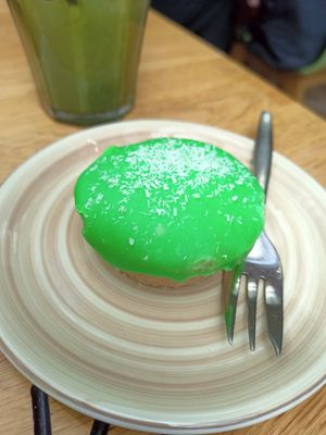Not so pink cake and iced soy matcha latte at Bagels & Beans - Catharijne Esplanade  in Utrecht