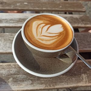 Flat white coffee on hazelnut milk at Bread House in Torun