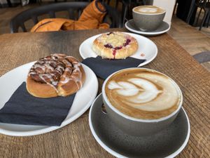 Cappuccino with oat milk and pastries  at Bread House in Torun