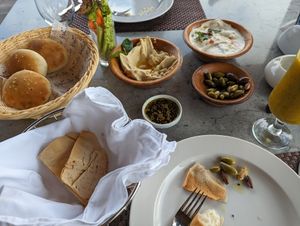Hummus with pine nuts and tahini. Mango kiwi juice. Note: round puffy breads contain milk. at Sidra By The Citadel in Alexandria