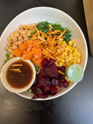 Poke bowl with vegan salmon and ponzu sauce at Poké Perfect - Nieuwendijk in Amsterdam