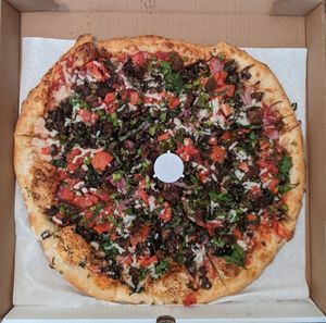 Vegan Pizza : The Sausage 16" + Bell Pepper, Fresh Garlic, Spinach, Red Onion, Mushrooms, Tomatoes, and Fresh Basil at Ariela's Pizza & Kosher Kitchen in Las Vegas