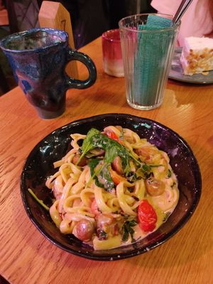 pasta with mushrooms, cherry tomatoes and spinach at Inclusive Cafe Ogurci in St Petersburg