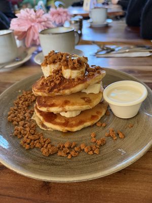 Triple Stacked Pancakes - Banana Biscoff, whipped vanilla yogurt and caramel drizzlee   at The Veg Box Cafe - Canterbury in Canterbury