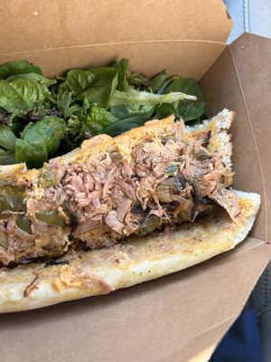 Delicious jackfruit cheesesteak- blew my mind it is soooo goood and the fresh salad completes it   at Naked Lunch in Philadelphia