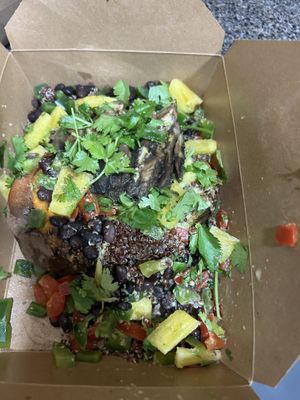 Sweet potato packed with so many fresh healthy toppings 🙌🏽  concoctions of the toppings definitely compliments the sweet potato in a unique way it surprised me, very good  at Naked Lunch in Philadelphia