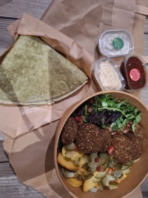 Falafel bowl with sauces and pita at Efendi Doner in Bucharest