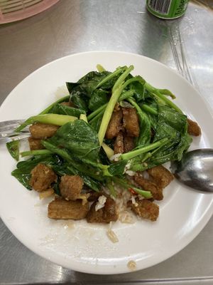 Delicious fried ‘pork’ and kale on rice  Really intimate and local restaurant located in the alley. Freshly made, big sortiment of vegan dishes  at Jay Oh Vegetarian in Bangkok