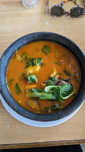 Fufu with palm nut soup, with tofu, mushrooms and pak choi at Tatale Vegan Restaurant in Accra