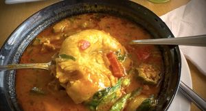 Fufu in the rich creamy gravy consisting  at Tatale Vegan Restaurant in Accra