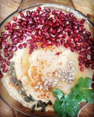 Hummus with pomegranate and seeds at Frutopia Palm Mar in Tenerife