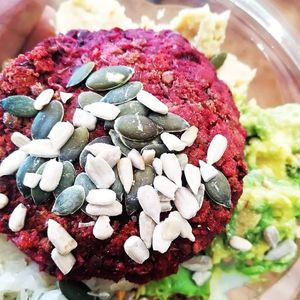 Buddha bowl with beetroot burger at Frutopia Palm Mar in Tenerife