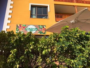 The store front on the bottom floor of an apartment building at Frutopia Palm Mar in Tenerife