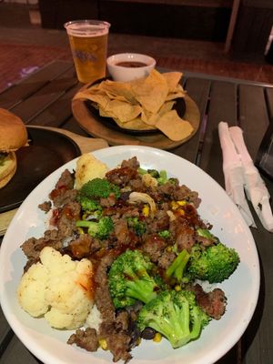 Bowl with coconut rice, impossible, beans & corn, broccoli & cauliflower and thai sweet chili.  at Caddy's On Central in St Petersburg