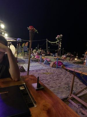 Outdoor beach seating at Blue Moon Bar in Koh Lanta