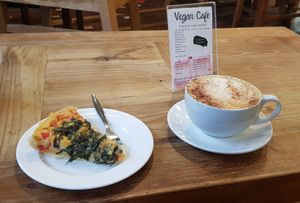 Vegan Quiche and cappuccino at Zero Waste Hub in Edinburgh