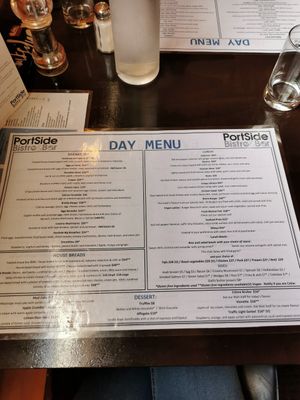 The (V) means vegan. They have a evening menu that is different at Portside in Westport