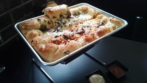 Pizza: half veggie deluxe, half jalapeno. at 4th & State in Columbus