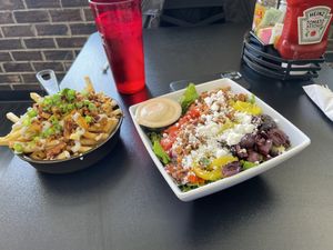 Greek salad (Caesar dressing) & loaded fries  at 4th & State in Columbus