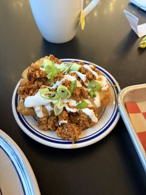 Chorizo, sour cream, queso loaded hashbrowns  at 4th & State in Columbus