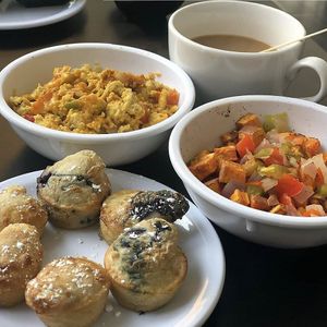 Cheesy JustEgg scramble (top), sweet potato home fries, and pancake bites (bottom). at 4th & State in Columbus