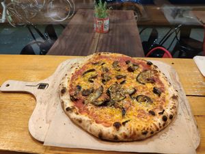 Marinara base with Wilmersburger vegan cheese, garlic and aubergine. at NeoNeo in Cologne