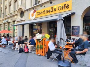 Outdoor seating at Coccinelle Café in Lausanne