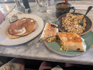 Breakfast burrito with cauliflower grits and vegan pancakes yummy! at Bearcat Cafe - CBD in New Orleans