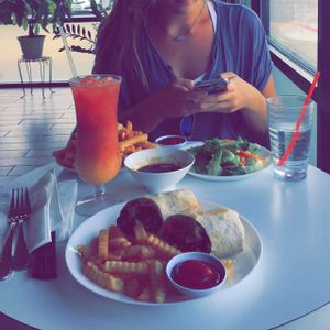 Wrap and Orange Joy drink  at Loving Hut in Houston