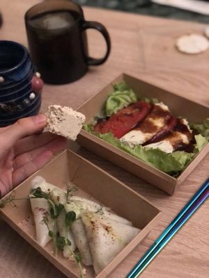 the food i took home: "caprese" salat and vareniki (and rambol in my hands, moscow vegans knows)  at Raw To Go in Moscow