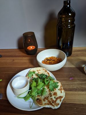 naan with yoghurt sauce, beans at Leuchtendroter in Frankfurt