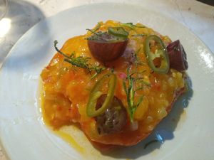 Giant tomato topped with spicy and satisfying tomato sauce at Leuchtendroter in Frankfurt