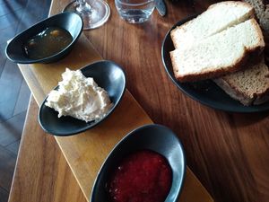 Breakfast: brioche and sourdough slices with apple and strawberry jam at Leuchtendroter in Frankfurt