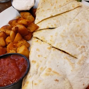 Santa fe quesadilla with home fries and vegan sour cream at Rutherford Pancake House in Rutherford