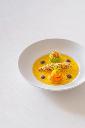 Roasted and glazed chicory, spicy carrot, pointed cabbage, roasted quinoa with macadamia, black miso cream at Lafleur in Frankfurt