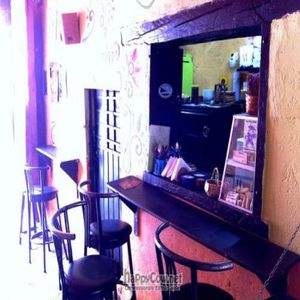 Old location, from 2010. The reverse view, looking 'into' the cooking area/window, and back towards to the street. at Prasada in Cusco