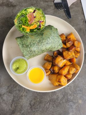 vegan avocado falafel wrap with sweet potato fries, avo and mango sauce at Smash Avocaderia y Cafe in Medellin