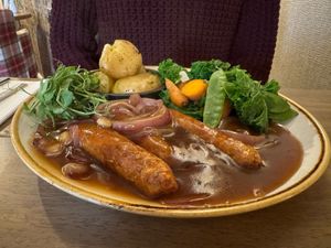 Vegan sausages, herby baby potatoes, red onion gravy & veg at Warkworth House Hotel in Warkworth
