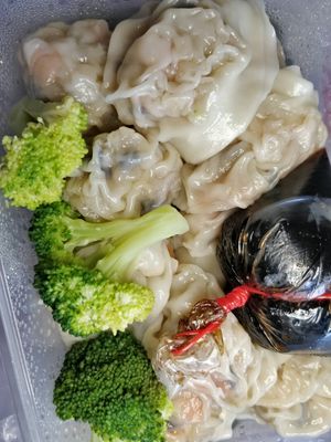 homemade dumplings with broccoli and packet of  vinegar  at Botanict 豐之素 in West Singapore